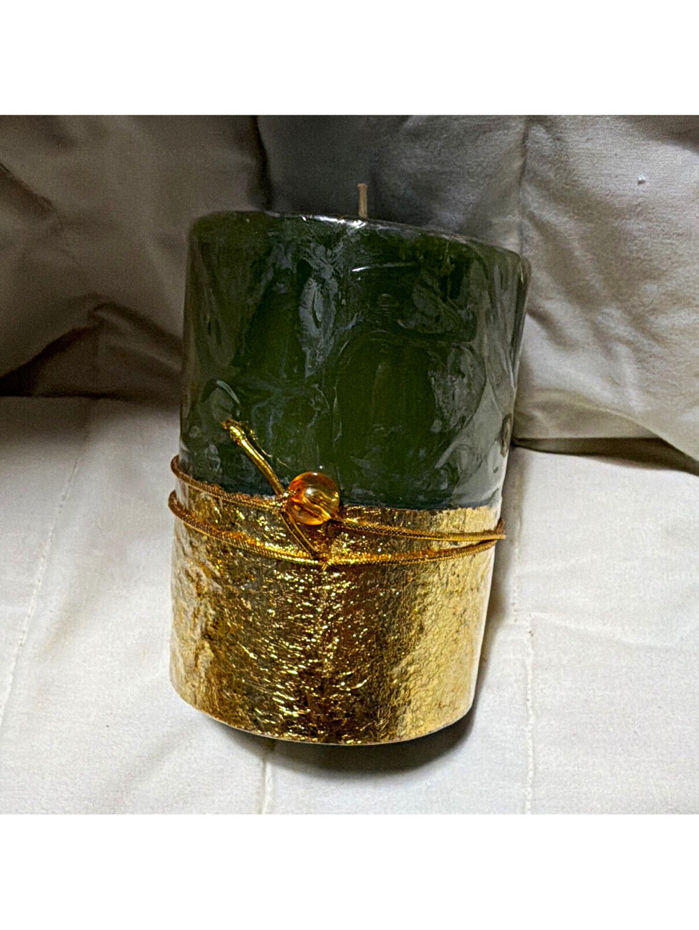 Green pillar candle gold bottom accent with bead